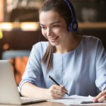 Smiling,girl,student,wear,wireless,headphone,study,online,with,skype